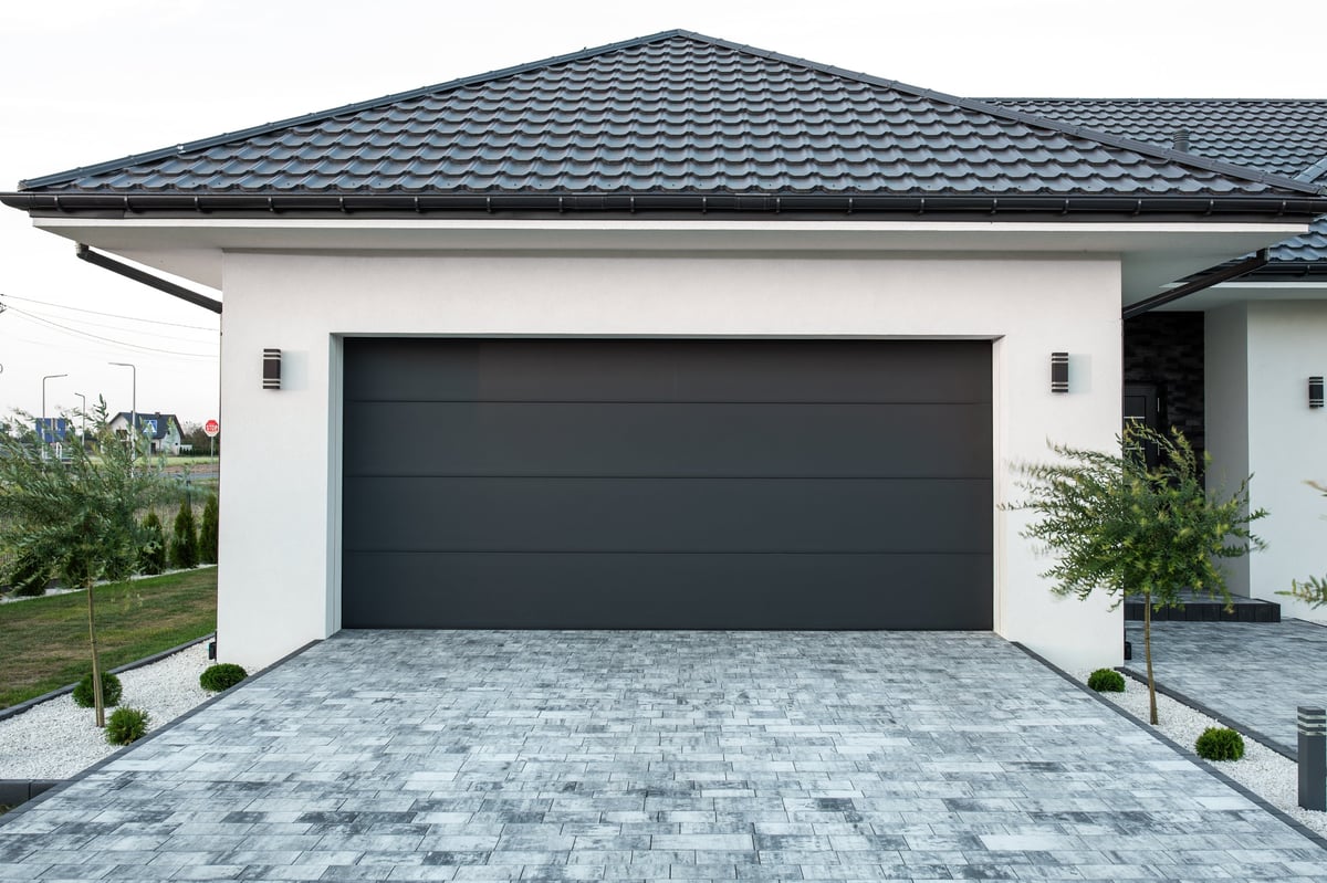 Luxurious modern house with designer garage entrance