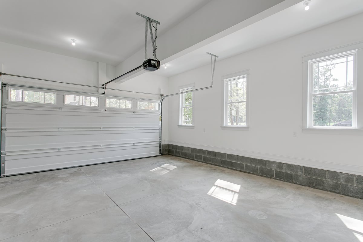 Modern garage with dual overhead doors and natural light